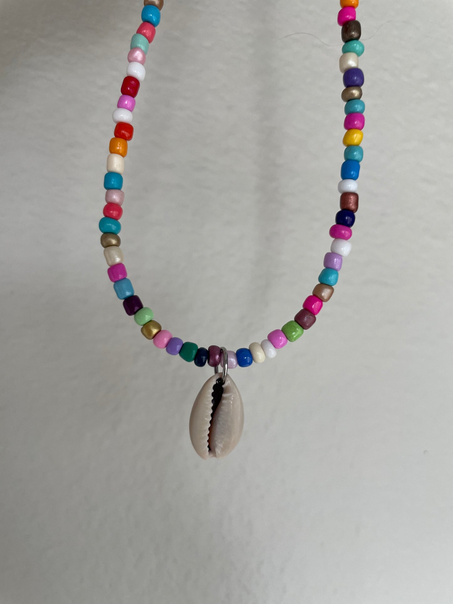 Multi color cowrie pendant