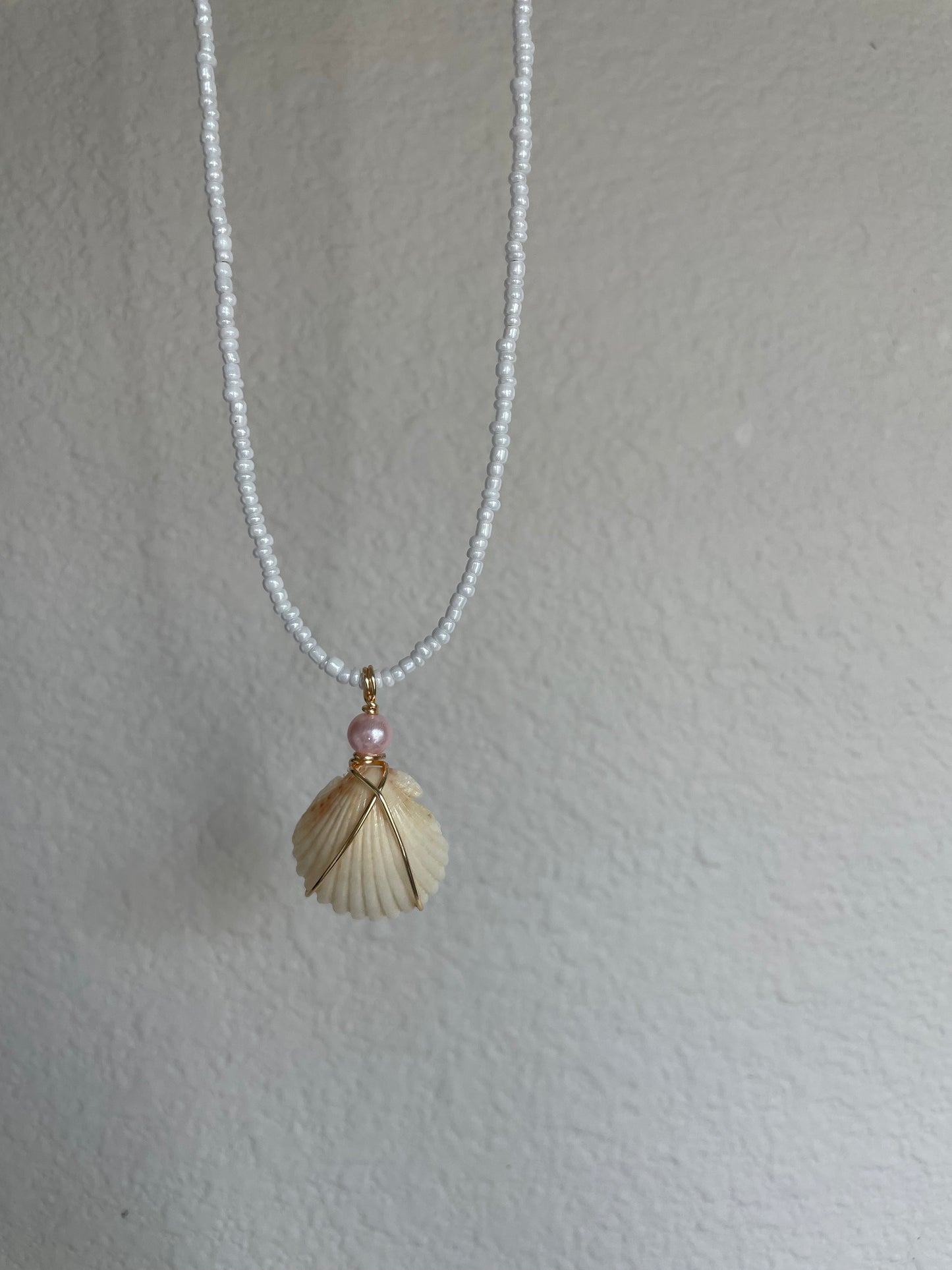 Statement shell with pink pearl