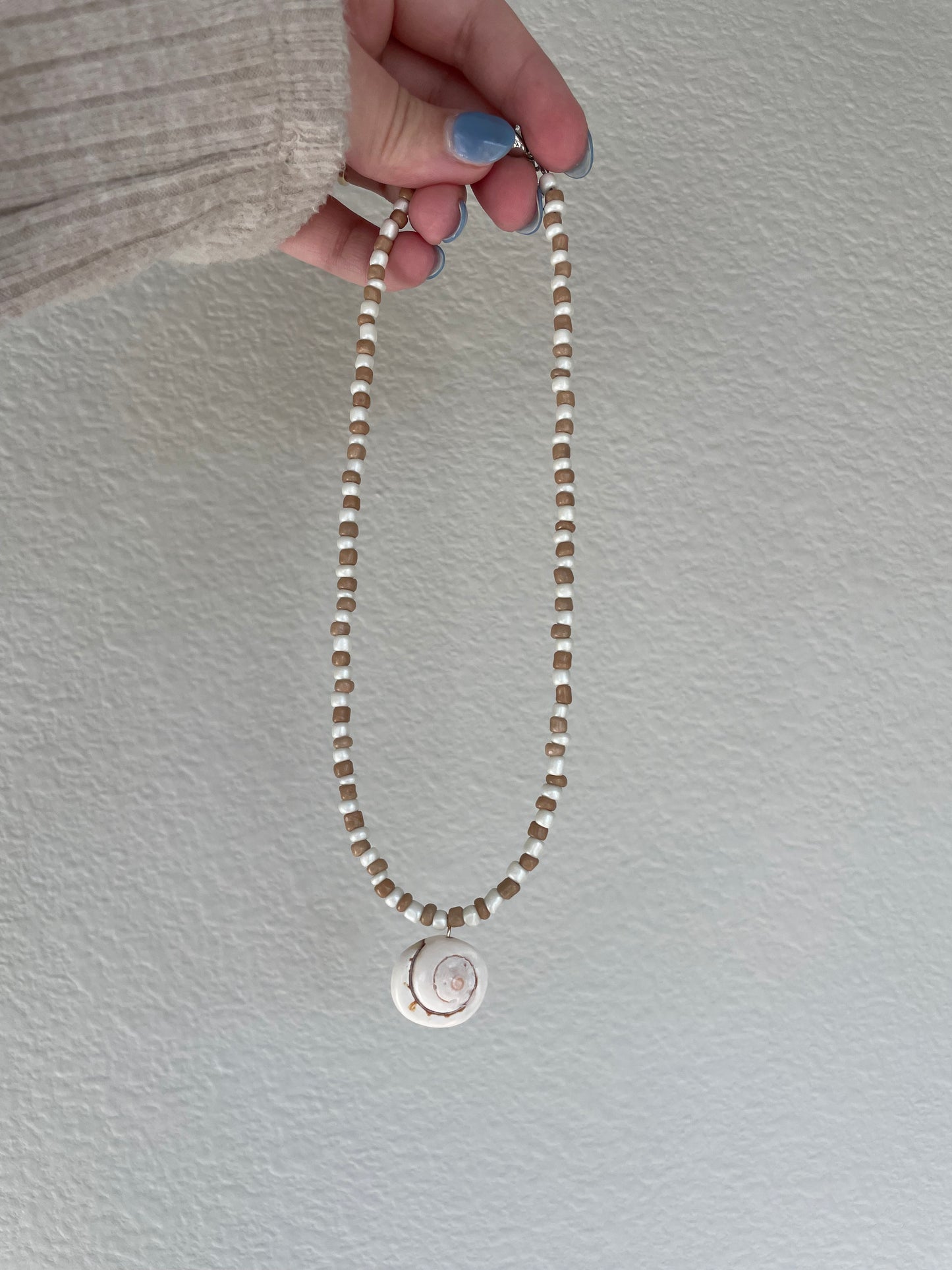 Brown and cream spiral shell necklace