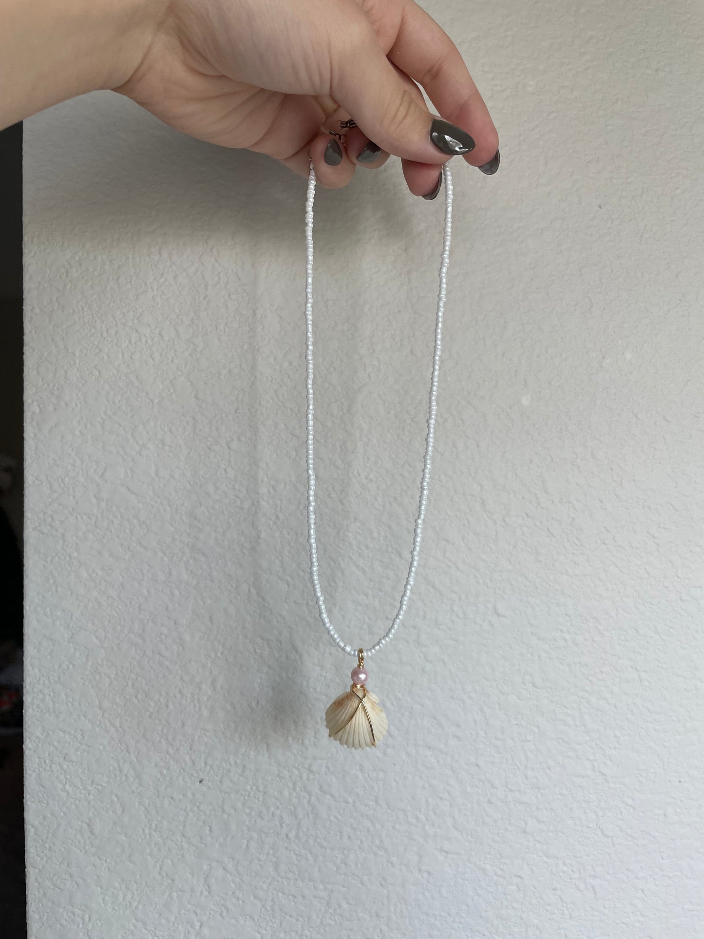 Statement shell with pink pearl