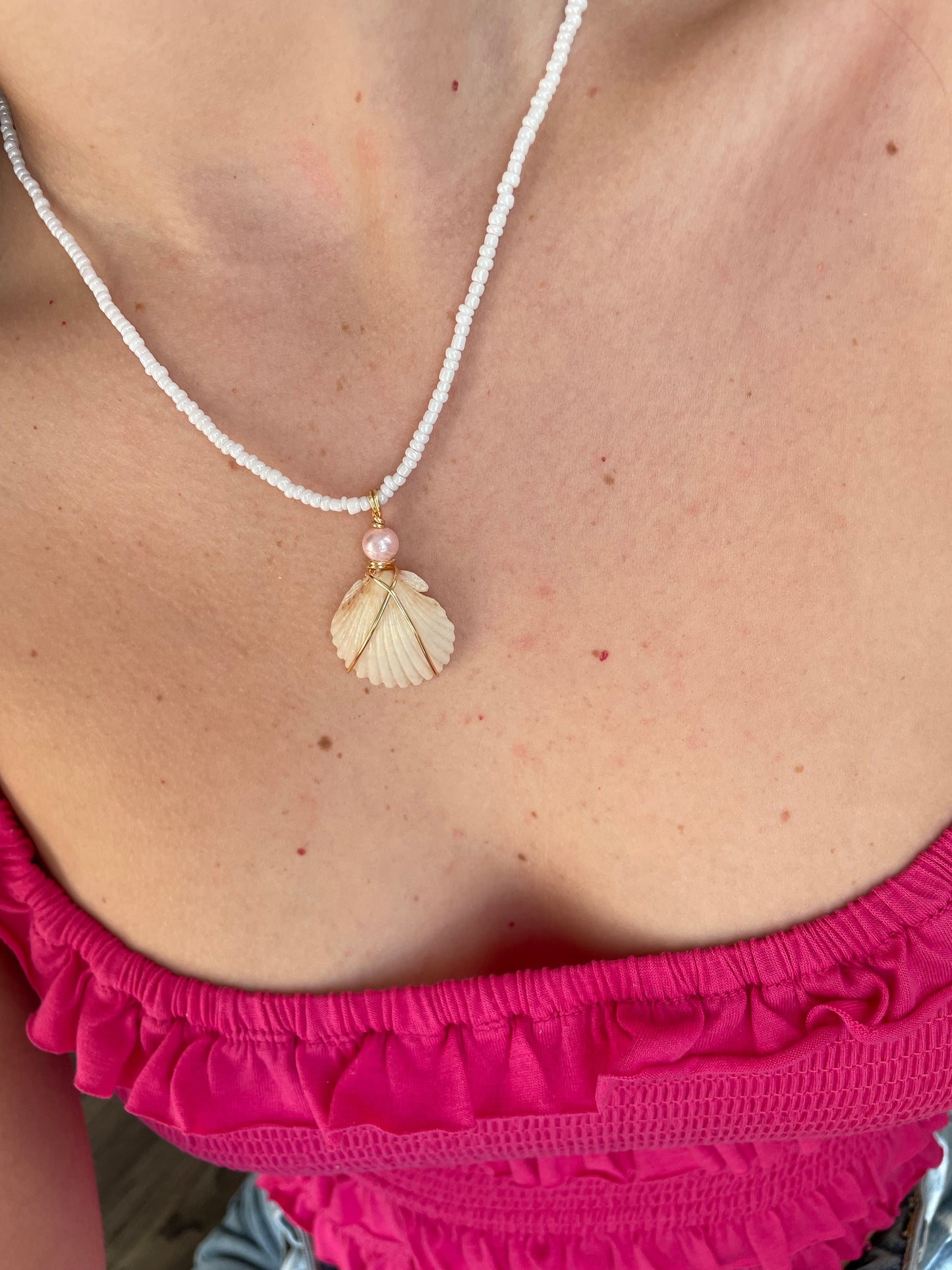 Statement shell with pink pearl