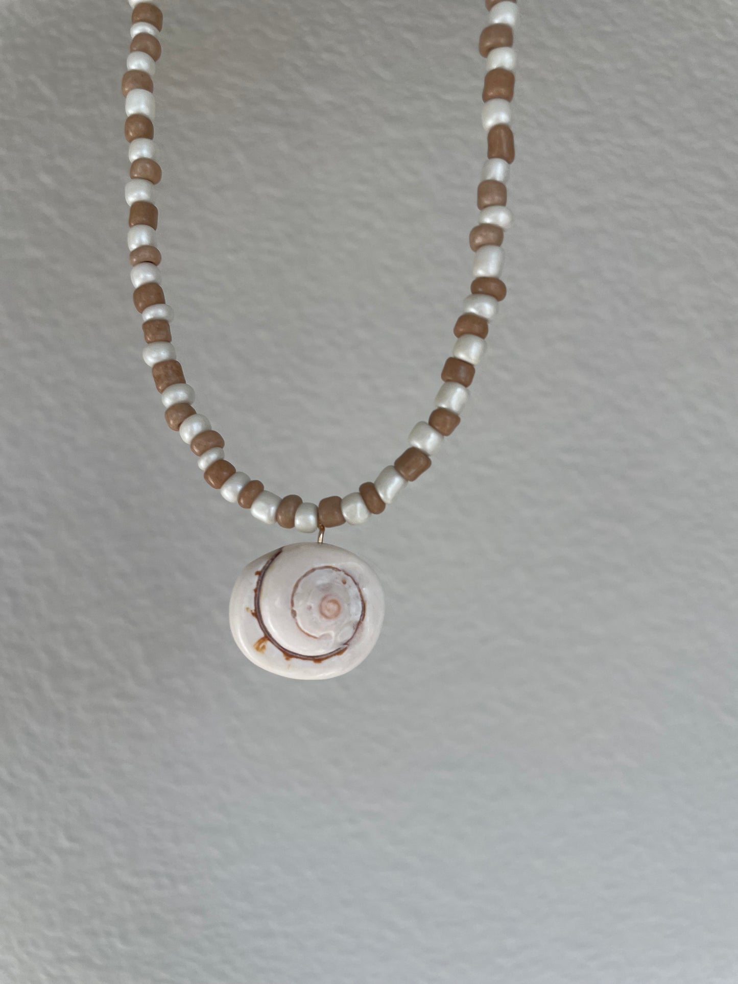 Brown and cream spiral shell necklace